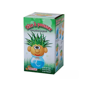 Tête à pousser avec graines de gazon 