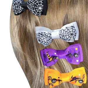 Lot de 4 barrettes nœuds Halloween (coloris aléatoire) 
