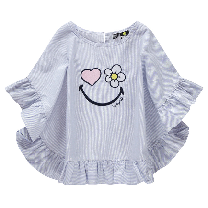 Top effet poncho légèrement brillant à fines rayures et SmileyWorld brodé 
