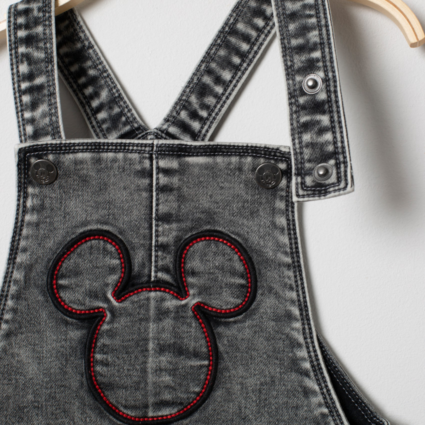 Salopette en jean effet used doublée motif Mickey Disney 