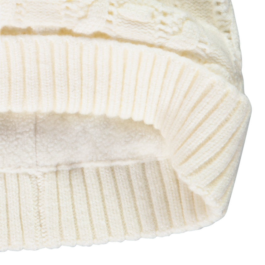 Bonnet en tricot torsadé avec pompon pour fille 