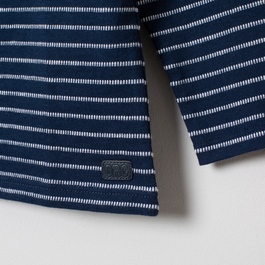 Polo manches longues en coton à rayures en jacquard 