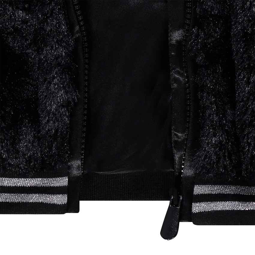 Veste en fausse fourrure reliefée avec noeuds brodés 