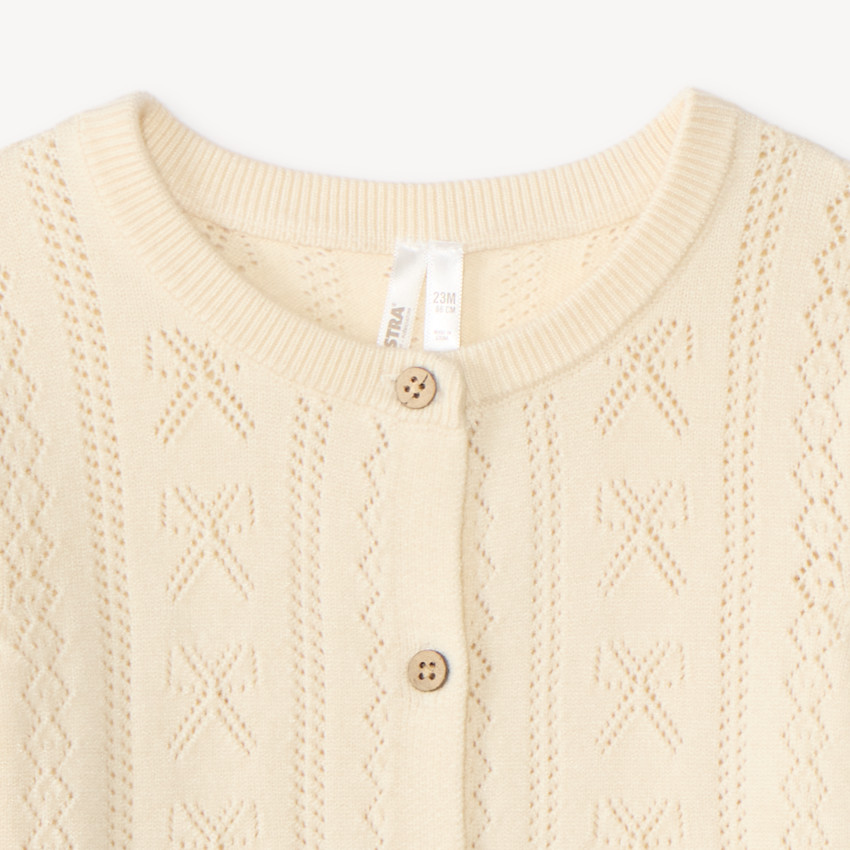 Gilet en tricot ajouré bébé fille 