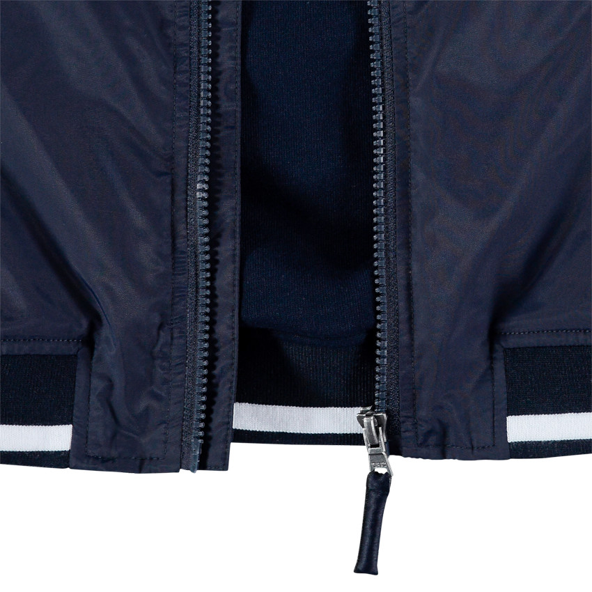 Blouson style teddy à inscriptions printées et badge 