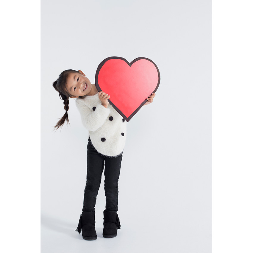 Pull en tricot poil avec pompons 