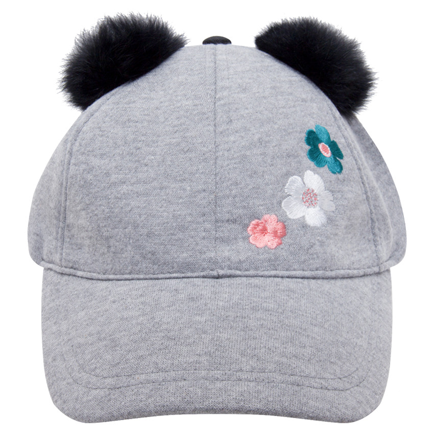 Casquette en jersey avec pompons et fleurs brodées 