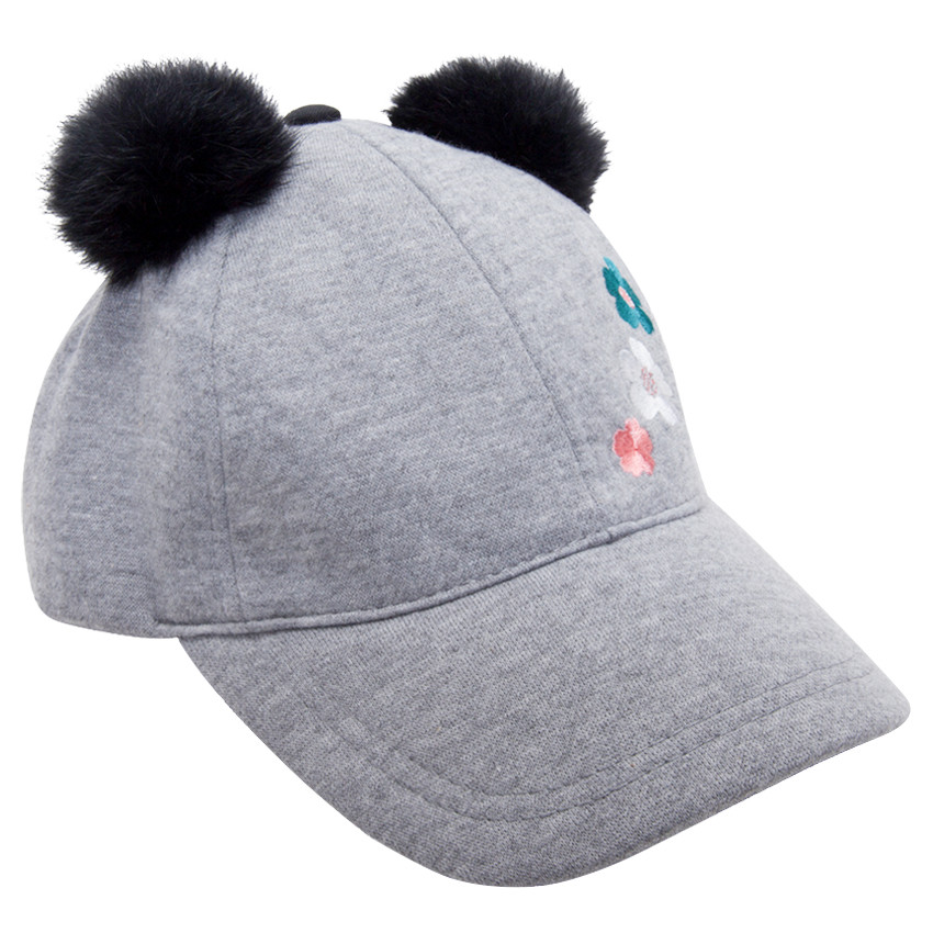 Casquette en jersey avec pompons et fleurs brodées 