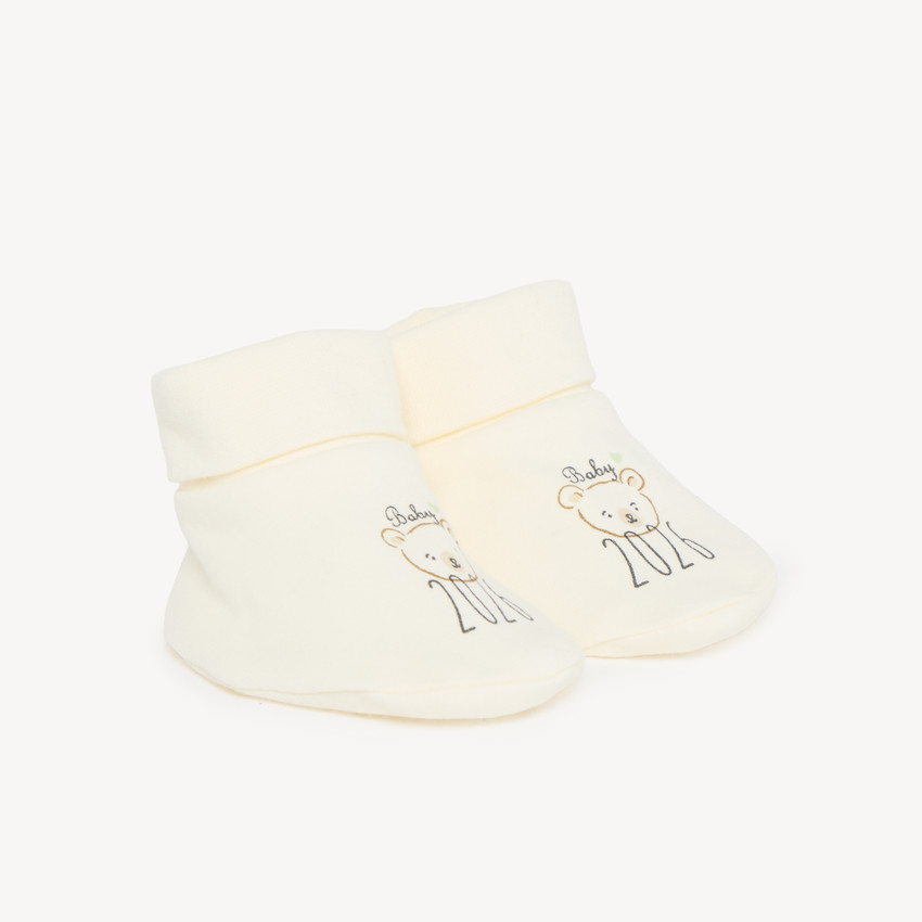Chaussons naissance en interlock "Baby 2026"
