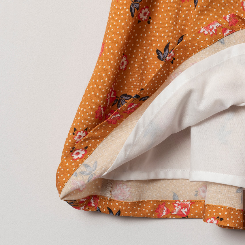 Robe sans manches à col croisé imprimée pois et fleurs  