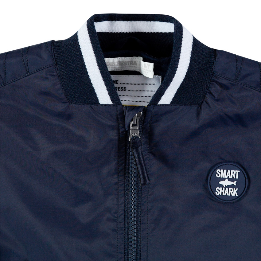 Blouson style teddy à inscriptions printées et badge 