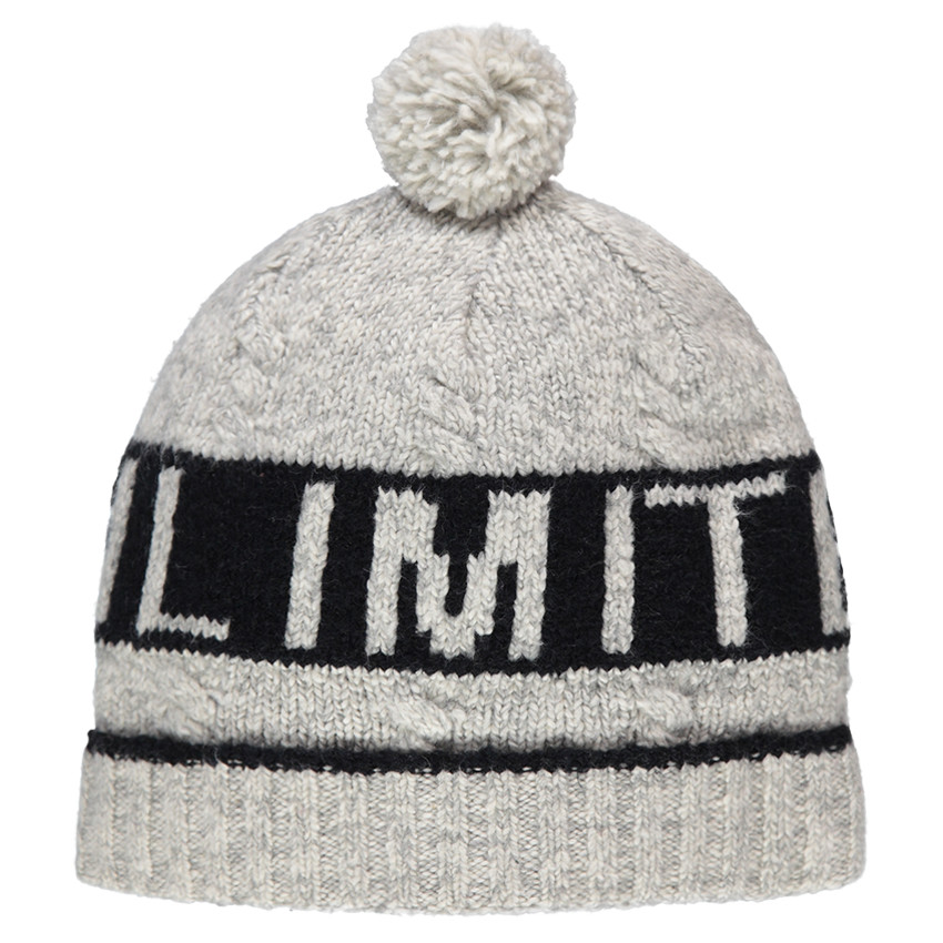 Bonnet en tricot avec texte en jacquard et pompon