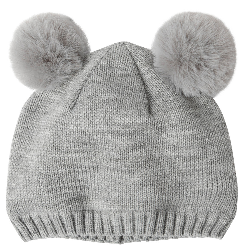 Bonnet en tricot et pompons en fausse fourrure 