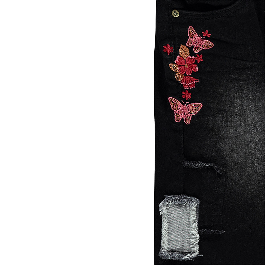 Jeans effet used avec broderies florales 