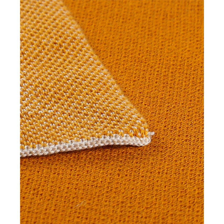 Couverture en tricot jacquard Bio Tiga 100 x 140 cm ocre 