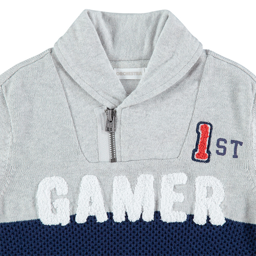 Pull tricolore avec col zippé et inscription en bouclette 