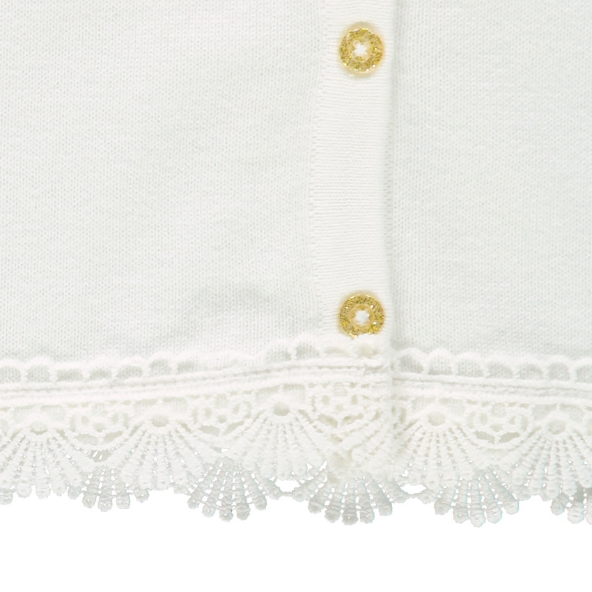 Gilet en tricot fin avec crochet et pompons 