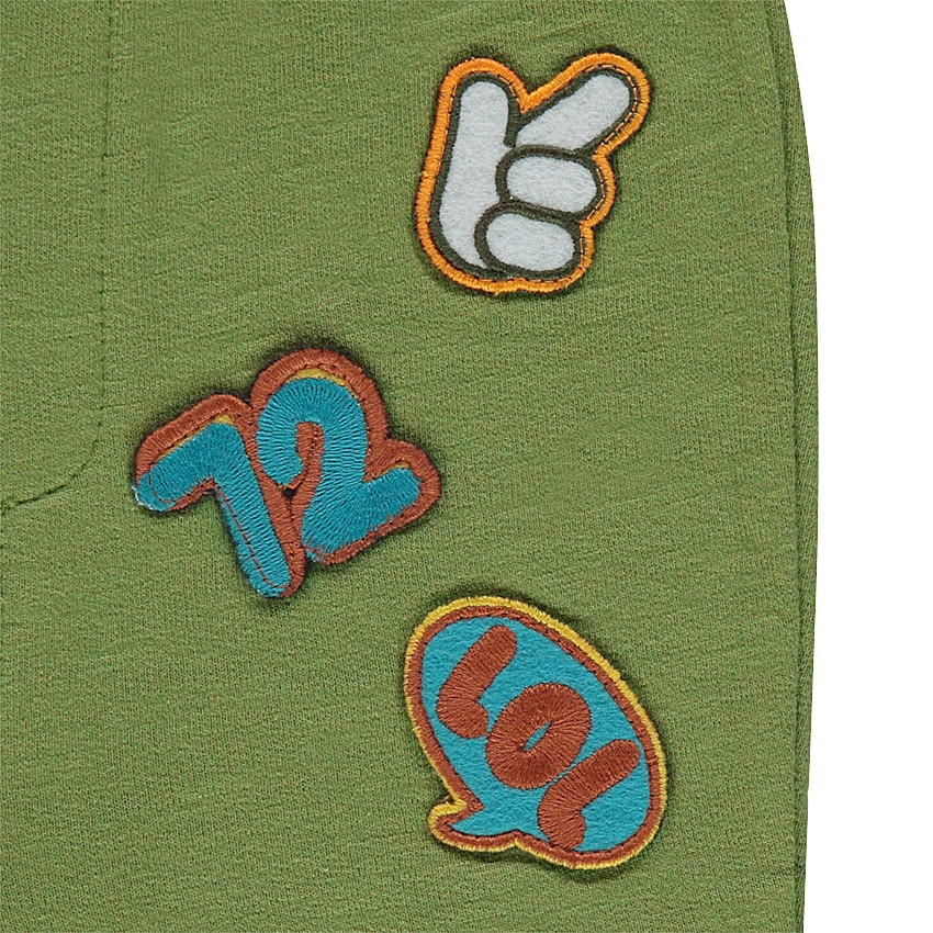 Jogging en molleton avec Smiley brodé et badges 